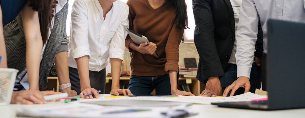 Group of professionals working on a Quality Management Systems Consulting project